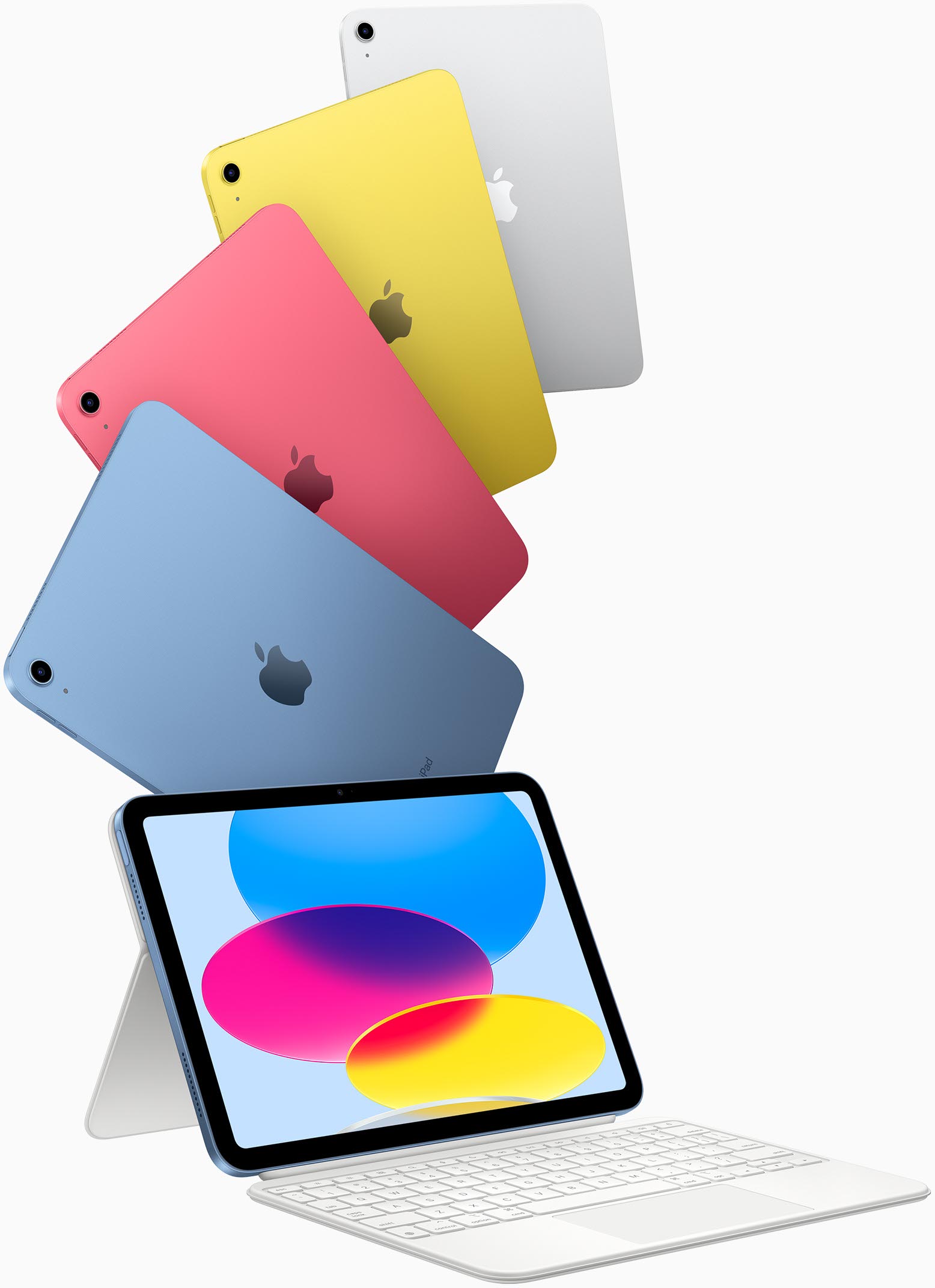 Kék, rózsaszín, sárga és ezüstszínű iPad és egy Magic Keyboard Folióhoz csatlakoztatott iPad